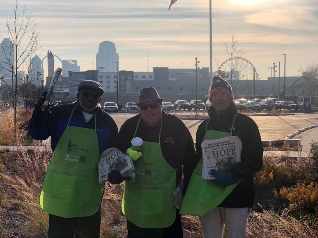 three men club members standing to volunteer for old news boys